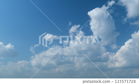 Clouds running across the blue sky. White puffy and fluffy clouds on blue sky. Timelapse. 115571728