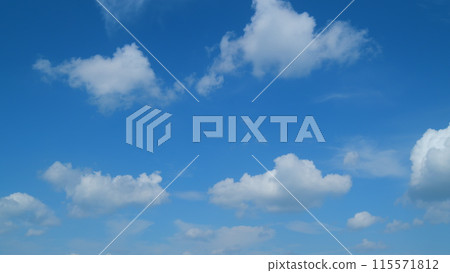 Sky with bautiful silky clouds. Puffy fluffy cumulus and cirrus on different layers clouds. Timelapse. 115571812