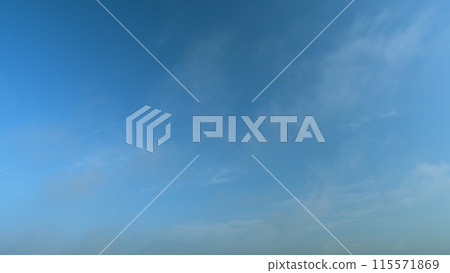 Flying moving white clouds in a blue sky. Blue sky background with many layers tiny clouds. Timelapse. Flying moving white clouds in a blue sky. Blue sky background with many layers tiny clouds. Timelapse. 115571869