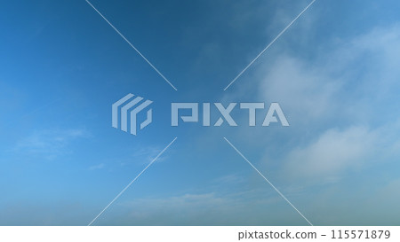 Fluffy layered clouds sky atmosphere. Puffy fluffy white clouds. Formation cloud sky scape. Timelapse. 115571879
