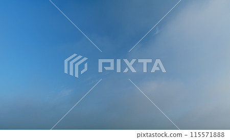 Soft white clouds moving on blue sky background. Tropical summer or spring sunlight. Daytime. Timelapse. 115571888
