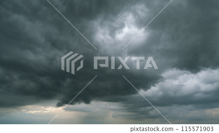 Dramatic dark blue thunderclouds. Dark stormy sky with rainy clouds. Typhoon sky. Timelapse. Dramatic dark blue thunderclouds. Dark stormy sky with rainy clouds. Typhoon sky. Timelapse. 115571903