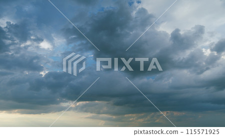 Gray cumulus rain dark clouds panoramic view. Massive dark rain storm clouds bg for weather forecast. Timelapse. Gray cumulus rain dark clouds panoramic view. Massive dark rain storm clouds bg for weather forecast. Timelapse. 115571925