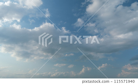 Cloud stratocumulus nature background. Blue sky with cumulus clouds and sun. Nature background of airy cloudscape. Timelapse. Cloud stratocumulus nature background. Blue sky with cumulus clouds and sun. Nature background of airy cloudscape. Timelapse. 115571940
