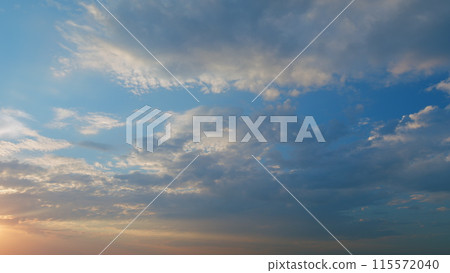 Intense dramatic panoramic sunset. Abstract different shades clouds at sunset sky background. Timelapse. Intense dramatic panoramic sunset. Abstract different shades clouds at sunset sky background. Timelapse. 115572040