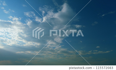 Majestic amazing sky. Sunburst or sun rays light beam through the clouds as fantastic background. Timelapse. Majestic amazing sky. Sunburst or sun rays light beam through the clouds as fantastic background. Timelapse. 115572083