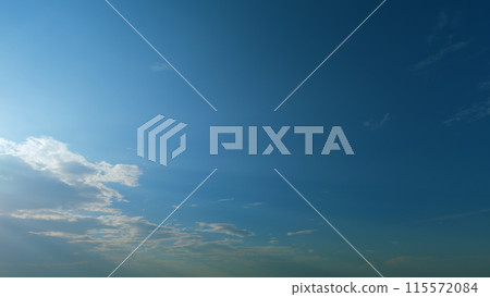 Sunrays sunray shine through dark clouds in cloudy blue sky. Layers of cloud space. Natural background. Timelapse. Sunrays sunray shine through dark clouds in cloudy blue sky. Layers of cloud space. Natural background. Timelapse. 115572084