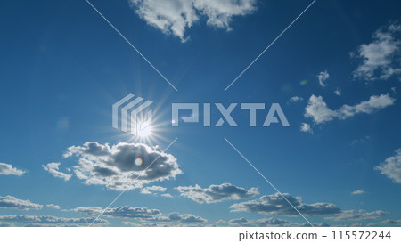 Shining sun rays and eventually breaking through cloud mass. Clouds beautiful sky sunbeams cloud open air. Timelapse. 115572244