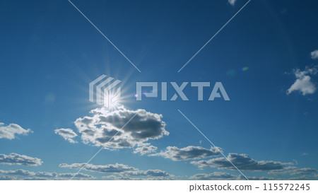 Cloudscape in tropical summer or spring sunlight. Beautiful sun rays shine through the clouds creating peaceful atmosphere. Timelapse. Cloudscape in tropical summer or spring sunlight. Beautiful sun rays shine through the clouds creating peaceful atmosphere. Timelapse. 115572245