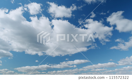 Summer clouds float across blue sky. Blue sky white clouds. Timelapse. Summer clouds float across blue sky. Blue sky white clouds. Timelapse. 115572322