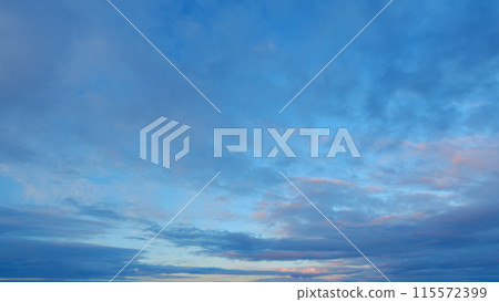 Beautiful colorful panorama of summer sunset blue sky with different shades. Timelapse. 115572399