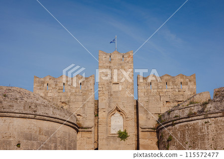 Travel to Greece, Mediterranean islands Rhodes. The walls of the medieval city of Rhodes, fortified stone walls of the fortification defense system of the old city. Travel to Greece, Mediterranean islands Rhodes. The walls of the medieval city of Rhodes, fortified stone walls of the fortification defense system of the old city. 115572477