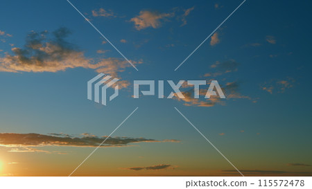 Summer sky at sunset with clouds. Cloudscape in tropical summer sunlight. Timelapse. Summer sky at sunset with clouds. Cloudscape in tropical summer sunlight. Timelapse. 115572478