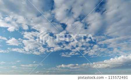 Clear blue sky with white wispy smoke cumulus and cirrocumulus on different layers clouds. Blue sky background with tiny stratus cirrocumulus striped clouds. Timelapse. Clear blue sky with white wispy smoke cumulus and cirrocumulus on different layers clouds. Blue sky background with tiny stratus cirrocumulus striped clouds. Timelapse. 115572491