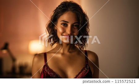 Charming and spirited Hispanic lingerie model under soft studio lights sporting luxurious velvet lingerie set 115572521