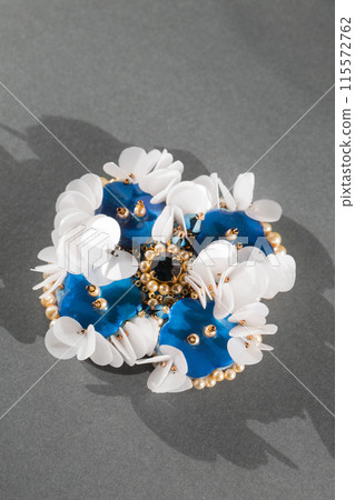 Handmade brooch with mother-of-pearl blue buttons and white sequins 115572762