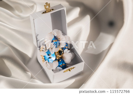 Handmade brooch with mother-of-pearl buttons in a box 115572766