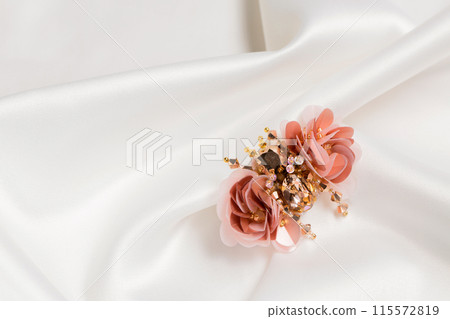 handmade brooch in the shape of a beetle on white silk handmade brooch in the shape of a beetle on white silk 115572819