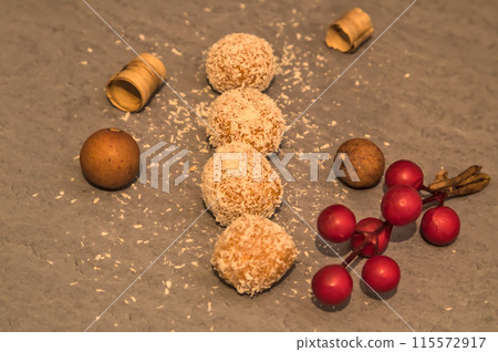 homemade chocolate-filled bonbons dipped in coconut 115572917