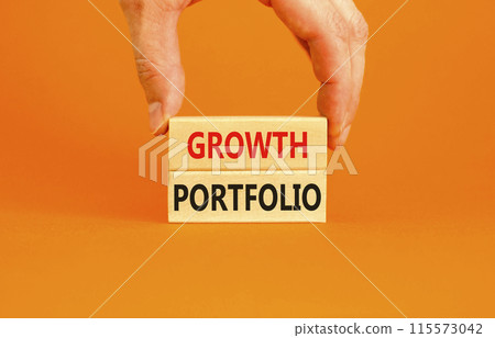 Growth portfolio symbol. Concept words Growth portfolio on beautiful wooden block. Beautiful orange paper background. Businessman hand. Business Growth portfolio concept. Copy space. Growth portfolio symbol. Concept words Growth portfolio on beautiful wooden block. Beautiful orange paper background. Businessman hand. Business Growth portfolio concept. Copy space. 115573042