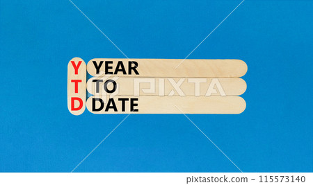 YTD year to date symbol. Concept words YTD year to date on beautiful wooden stick. Beautiful blue background. Business YTD year to date concept. Copy space. YTD year to date symbol. Concept words YTD year to date on beautiful wooden stick. Beautiful blue background. Business YTD year to date concept. Copy space. 115573140
