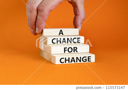 A chance for change symbol. Concept words A chance for change on beautiful wooden block. Beautiful orange table orange background. Voter hand. Business A chance for change concept. Copy space. A chance for change symbol. Concept words A chance for change on beautiful wooden block. Beautiful orange table orange background. Voter hand. Business A chance for change concept. Copy space. 115573147