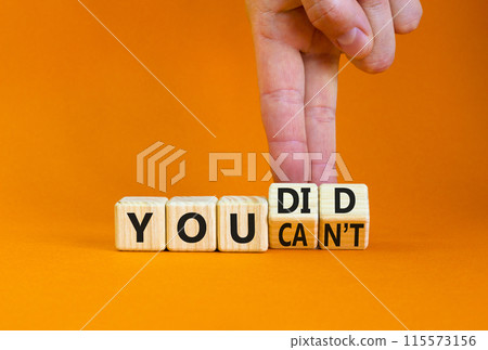 You can not or did it symbol. Concept word You did or You can not on beautiful wooden cubes. Beautiful orange background. Businessman hand. Business and you did or can not concept. Copy space. 115573156