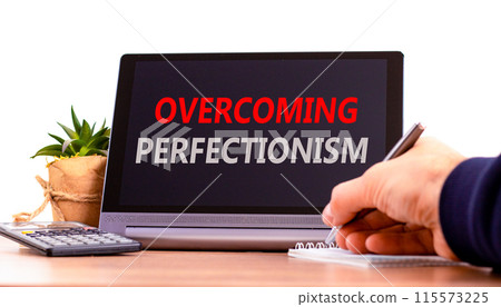 Overcoming perfectionism symbol. Concept words Overcoming perfectionism on beautiful black pad. Beautiful white background. Businessman hand. Business Overcoming perfectionism concept. Copy space. Overcoming perfectionism symbol. Concept words Overcoming perfectionism on beautiful black pad. Beautiful white background. Businessman hand. Business Overcoming perfectionism concept. Copy space. 115573225