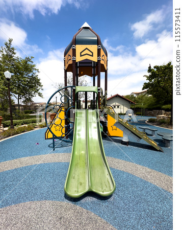 Colorful children playground activities in community public park  115573411