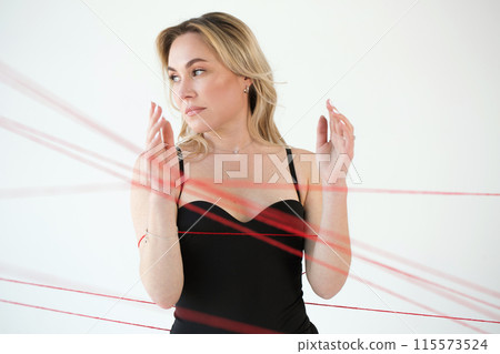 An adult woman with red threads. An adult woman with red threads. 115573524