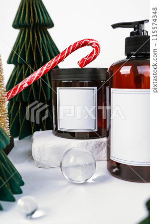 dark jar with lid and dispenser on the background of Christmas decorations, side view 115574348