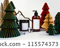 dark jar with lid and dispenser on the background of Christmas decorations, side view 115574373
