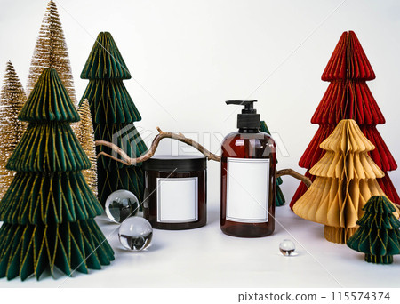 dark jar with lid and dispenser on the background of Christmas decorations, side view 115574374