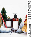 dark jar with lid and dispenser on the background of Christmas decorations, side view 115574379