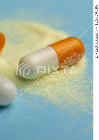 medical drugs in close-up on a blue background medical drugs in close-up on a blue background 115574698