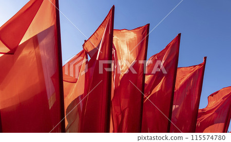 red flags set up during the celebration in windy weather red flags set up during the celebration in windy weather 115574780