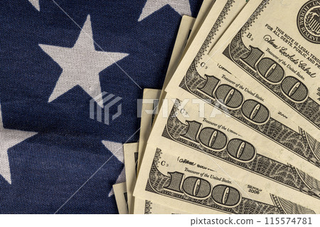 American dollars and the American flag 115574781