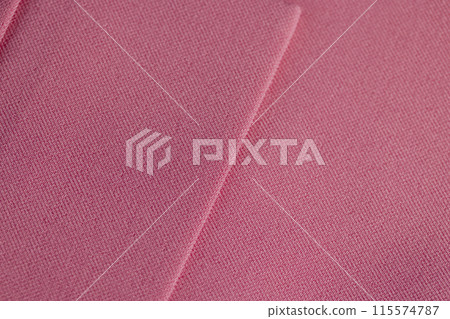 a piece of clothing made of pink fabric 115574787