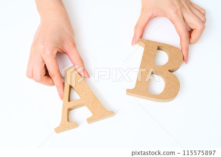Wooden alphabet blocks "A" and "B" lined up Wooden alphabet blocks "A" and "B" lined up 115575897