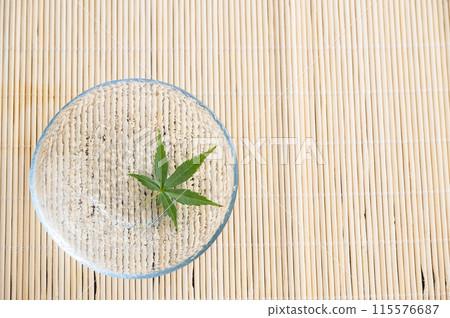 Blue maple floating on the water Blue maple floating on the water 115576687