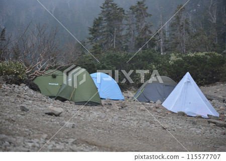 Tent site in the rain 115577707