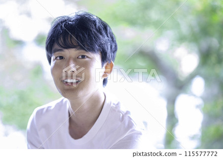 Young man in white T-shirt Young man in white T-shirt 115577772