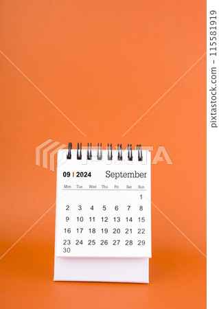 Vertical of Septemberl 2024 table calendar on orange background. 115581919