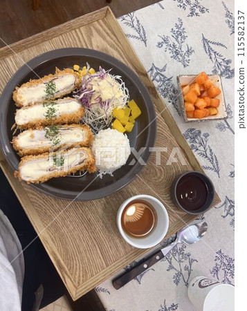 Tonkatsu Set Meal Tonkatsu meal on floral tablecloth table 115582137