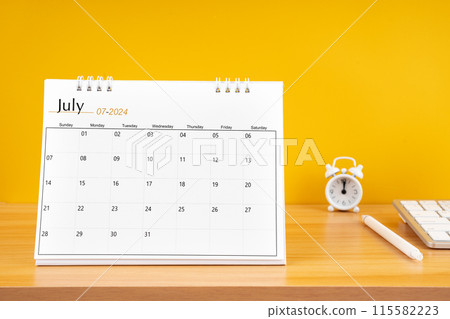 July 2024, Monthly desk calendar for 2024 year on wooden table. 115582223