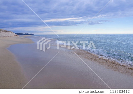 Beach on a cloudy day Beach on a cloudy day 115583412