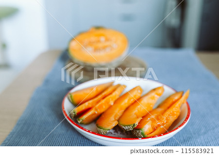 ripe melon cut on a plate 115583921
