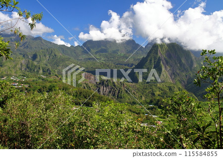 View of the mountains and basin from the cliffs of the village of Helbourg in the Cirque de Salazs, a World Heritage Site on the French overseas department of Reunion Island View of the mountains and basin from the cliffs of the village of Helbourg in the Cirque de Salazs, a World Heritage Site on the French overseas department of Reunion Island 115584855