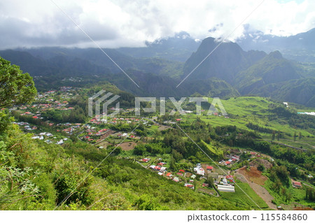 View of the mountains and basin from the cliffs of the village of Helbourg in the Cirque de Salazs, a World Heritage Site on the French overseas department of Reunion Island 115584860
