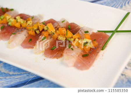 FISH CEVICHE RECIPE, SEA BREAM AND TUNA, AVOCADO, BELL PEPPER, CHILLI, CHIVES, LEMON, OLIVE OIL FISH CEVICHE RECIPE, SEA BREAM AND TUNA, AVOCADO, BELL PEPPER, CHILLI, CHIVES, LEMON, OLIVE OIL 115585350